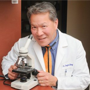 Dr. Douglas Young, MD at the microscope